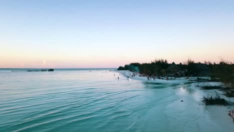 Calmer-slowly-rise-up-fly-forwards-drone-shot-over-wather-to-a-beach-party-Paradise-film-shot-on-zanzibar-at-africa-tanzania-in-2019-Cinematic-wild-nature-aerial-filmed-in-1080,-60p-by-Philipp-Marnitz