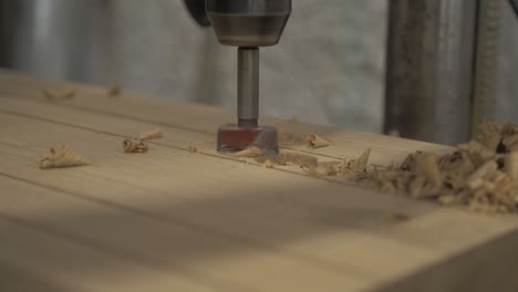 Pillar-drill-cutting-holes-in-white-oak-timber