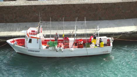 Italian-fishing-boat-docked-at-the-pier-high-angle-shot,-lipari-island-,-sicily