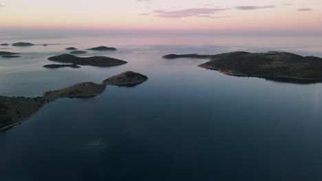 Beautiful-sunset-over-tranquil-sea-water,-paradisiac-Kornati-archipelago,-National-Park-Kornati