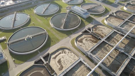 Aerial-orbit-over-the-clarifier-tanks-and-aeration-basins-in-huge-water-clarifying-plant
