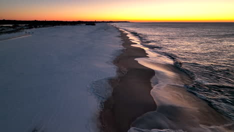 Snow-covered-beach-at-sunrise
