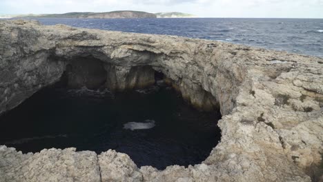 Panoramic-View-of-Coral-Lagoon-Cave-in-Malta-on-Windy-Winter-Day