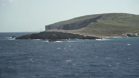 Mediterranean-Sea-Washes-Comino-Island-Shores-During-Winter-on-Sunny-and-Windy-Day