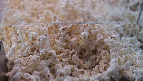 A-lot-of-popcorn-pours-in.-Close-up