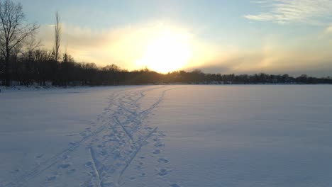 Snow-tracks-from-skis-and-shoes-winter-sunset