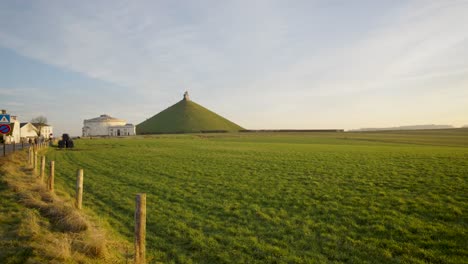 Wide-angle-of-Lion's-mound-around-arable-land-and-next-to-the-museum-of-Waterloo