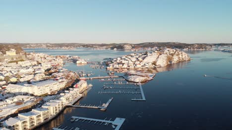 Sunlit-Coastal-Town-Of-Kragero-With-Oya-Island-And-Marina-In-The-Strait-On-A-Sunny-Winter-Day-In-Norway