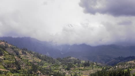 Valley-and-Mountains-Huacaran-behind-clouds-around-Yungay,-Ancash-Peru---4k