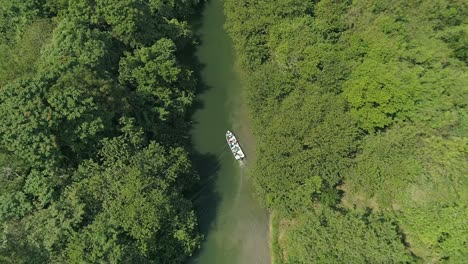 Boat-navigating-on-small-river-in-Humedales-Del-Ozama-National-Park-in-Dominican-Republic