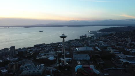 Aerial-of-Space-Needle-silhouette-as-the-sun-sets-over-the-Puget-Sound