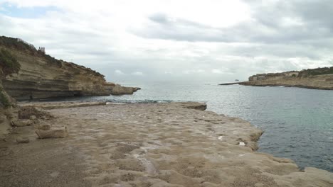 Plateau-of-Il-Kalanka-Beach-in-Malta-with-Splashing-Turquoise-Colour-Water-in-Bay