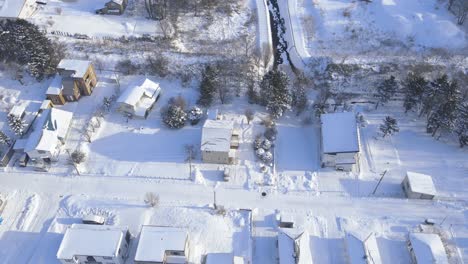 Aerial-Over-Snow-Covered-Town-Of-Omu-In-Hokkaido-With-Dolly-Forward-Towards-View-Of-Sea-of-Okhotsk