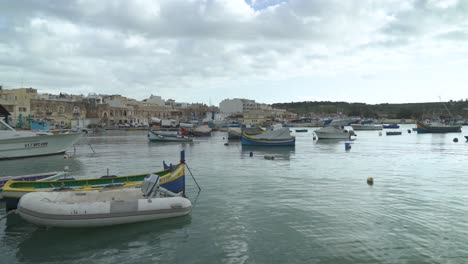 Traditional-Fishing-Boats-Decorated-with-Osiris-Eyes-in-the-Harbour-of-Marsaxlokk