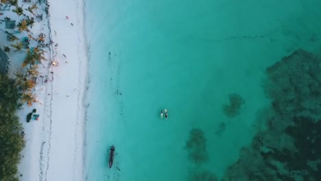 Marvelous-bird's-eye-view-top-view-stable-tripod-drone-shot-of-random-anonym-people-in-a-beach-bar
Drone-shot-on-Zanzibar-at-Africa-in-winter-2019
