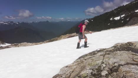Man-Hiking-on-Snow-up-Mount-5040,-Vancouver-Island,-Canada