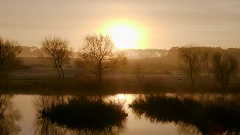 Scenic-sunrise-over-the-Nunnery-Lakes-in-Thetford,-Norfolk,-UK