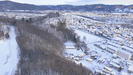 Aerial-View-Of-Engaru-Town-Snow-Covered-Landscape-In-Hokkaido