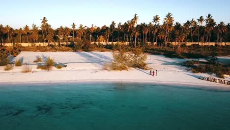 Perfect-fly-sideways-from-left-to-right-drone-shot-in-front-a-massai-dream-beach-at-sunset-Paradise-film-shot-on-Zanzibar-at-Africa-in-winter-2019-Golden-hours,-filmed-in-1080-60P-by-Philipp-Marnitz