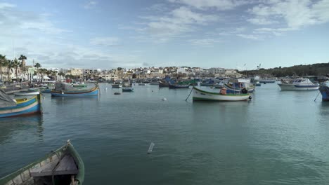 Multi-Coloured-Fishing-Boats-in-Fishing-Village-Marsaxlokk-in-Malta-on-Winter-Day