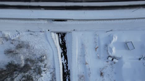 Aerial-Over-Snow-Covered-Highway-In-Town-Of-Omu-In-Hokkaido