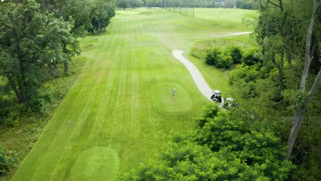 Drone-footage-of-golfer-at-Tee-box-driving