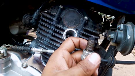 two-wheeler-motorbike-maintenance-at-day-from-flat-angle-in-details