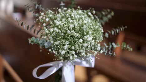 Orbit-motion-wedding-Bouquet-of-white-flowers,-Church-bench-decoration,-Close-up