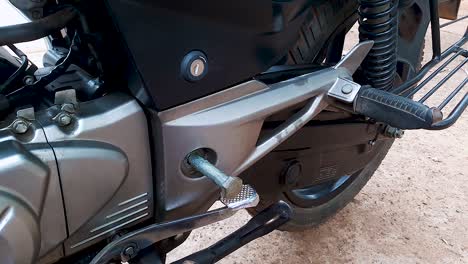 two-wheeler-motorbike-maintenance-at-day-from-flat-angle-in-details