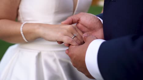 Close-up-groom-holding-Bride-hand-at-wedding-ceremony,-Love-concept