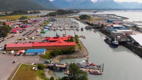 4K-Drone-Video-of-US-Coast-Guard-Station-in-Valdez-Boat-Harbor-in-Valdez,-Alaska-during-Sunny-Summer-Day