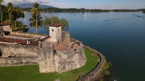 Rio-Dulce,-Hispanic-Fortress-in-Guatemala,-cinematic-drone-shot