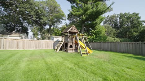 Children's-Swing-and-Jungle-Gym-in-the-Backyard-with-a-Slide-and-Monkey-Bars