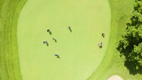 Drone-video-of-golfers-on-putting-green