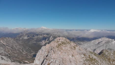 circular-drone-view-of-epic-Krn-plateau-in-Julian-alps,-Slovenia-on-sunny-day