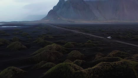 4k-Drone-Video-of-Car-driving-through-Iceland's-remote-Landscape