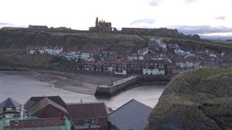 Whitby,-North-York-Moors,-Abbey-Headland-Pan-Shot,-early-morning-sunshine-North-Yorkshire-Heritage-Coast,-Yachts-and-Abbey-BMPCC-4K-Prores-422-Clip-1