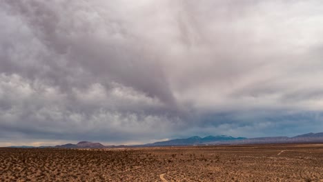 Clouds-roll-in-over-the-Mojave-Desert-basin-and-Joshua-trees---sliding-parallax-aerial-hyper-lapse