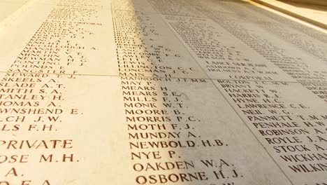 Names-of-Fallen-Soldiers-at-a-War-Memorial-Cemetery-in-Ypres-Belgium,-handheld-drifting-shot