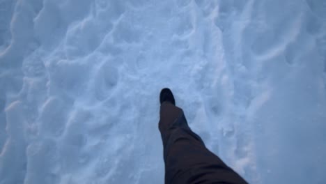 Walking-in-boots-in-snow-with-winter-trousers