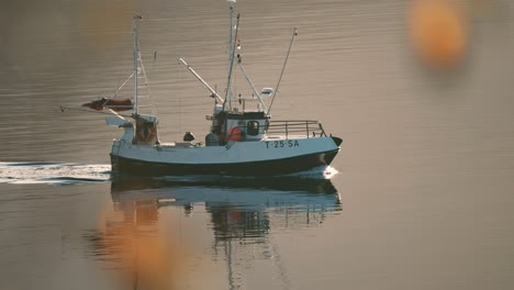 A-small-fishing-ship-crossing-the-fjord
