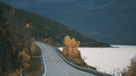 Narrow-two-lane-road-snaking-along-the-fjord