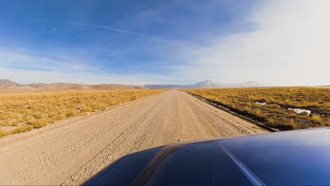 Driving-along-the-historic-Pony-Express-Trail-in-the-West-Desert-of-Utah-in-winter---driver-point-of-view