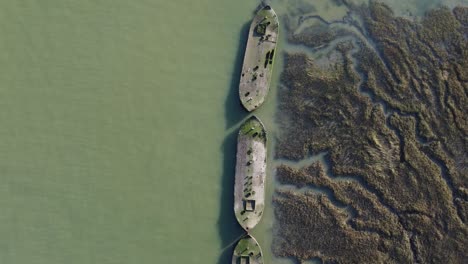A-top-down-view-of-barges-in-the-River-Medway-on-a-sunny-winter-afternoon