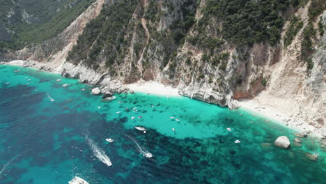 Aerial-drone-video-of-tropical-paradise-turquoise-beach-in-the-mediterranean,-Sardinia