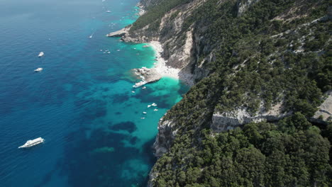 Aerial-drone-video-of-blue-paradise-beaches-in-the-mediterranean,-Sardinia,-Cala-Luna