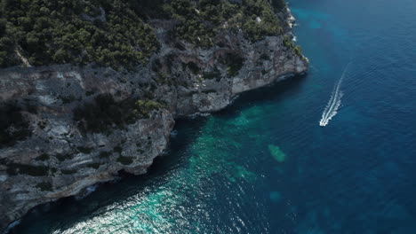 Aerial-drone-video-of-blue-paradise-sea-cliffs-in-the-mediterranean,-Sardinia,-Costa-Azzurra