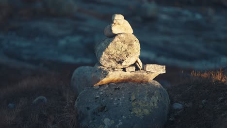 First-rays-of-the-rising-sun-light-up-the-stone-cairn