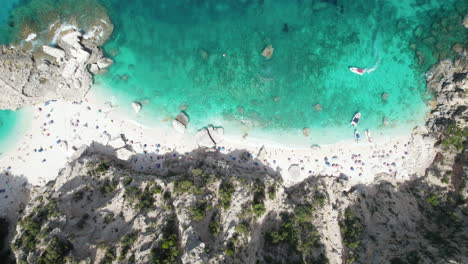 Aerial-top-down-drone-video-of-tropical-paradise-turquoise-beach-in-the-mediterranean,-Sardinia,-Cala-Mariolu