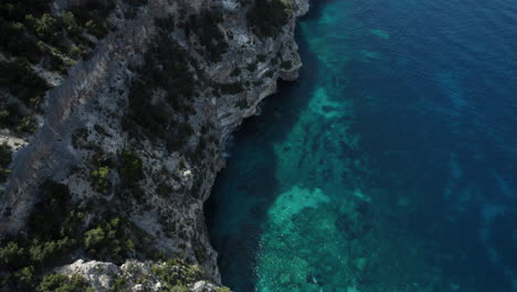 Aerial-drone-video-of-tropical-paradise-sea-cliffs-in-the-mediterranean,-Sardinia,-Costa-Azzurra